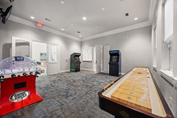 A room with a Super Chew table and an air hockey table.